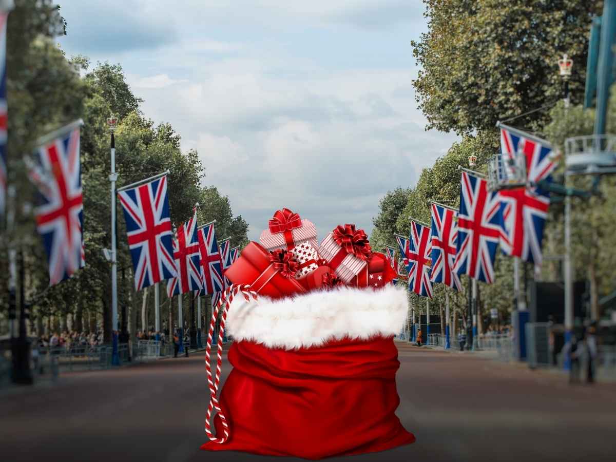 viale alberato con banbiere britanniche e sacco con regali di natale