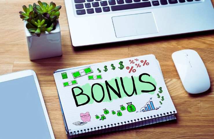 computer e block notes con scritto bonus